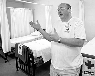 PATIENT READY: Alan Scannell, Red Cross event coordinator, talks about the splints, blisters and bee stings that are treated at the Canfield Fair. Scannell said he expects the number of patients to be up as the weekend brings sunny weather.