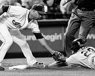 TAGGED OUT: Cleveland Indians third baseman Andy Marte, left, tags out Adrian Beltre of the Seattle Mariners at third base in the third inning of Friday's American League game at Progressive Field in Cleveland. Beltre tried for a stolen base.