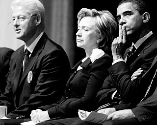 COMING TOGETHER: Democratic presidential candidate Barack Obama, right, sites on the stage with Sen. Hillary Rodham Clinton, D-N.Y., and her husband, former president Clinton, during the memorial service for Rep. Stephanie Jones, D-Ohio. The ceremony was Saturday at the Cleveland Convention Center.