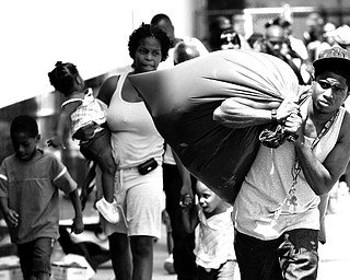 GETTING OUT: Jeffrey Vannor carries his belongings while evacuating from the approaching Hurricane Gustav at the Greyhound Bus and Amtrak station in New Orleans. A million people took to Gulf Coast highways Saturday, boarding up homes and businesses and fleeing the dangerous hurricane by bus and car as the season's most powerful Atlantic storm took aim at Louisiana.