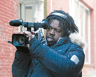 FOCUSED: Youngstown native Derrick Jones follows his passion for filmmaking with a documentary about inmates accused of murder during a riot at the Southern Ohio Correctional Facility in Lucasville. He has been awarded a prestigious grant for his work.