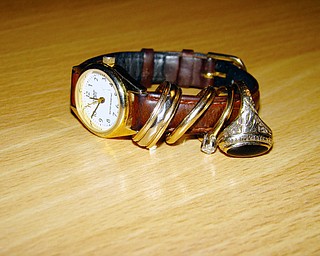 FOUND: The jewelry returned to Karen Scull included a watch, her wedding ring, a wedding band that belonged to a friend, her mother's 25-wedding anniversary ring and her college class ring.