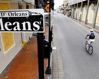LONELY: A bicyclist rides through the French Quarter of New Orleans. Most of the city has been evacuated.