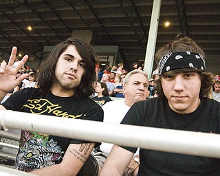 Julian Smith, 20, and Jon Banick, 19, both of Boardman, wait for Lynrd Skynrd to take the stage. Daniel C. Britt.