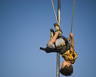 Dakota Bartells, 7, of N. Lima flips around the Fair on a bungee harness. Daniel C. Britt.