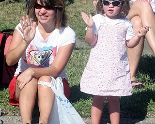 PARADE ROUTE: Renee Combine of Sharpsville and her daughter, Ava, 2, were among those who gathered to watch the parade that was part of the annual Buhl Day festivities in Hermitage. The parade and activities took place Monday.