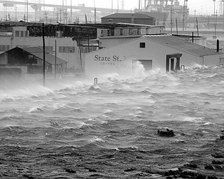 OVER THE WALL: Wind-driven water sloshes over the floodwall along the Industrial Canal as Gustav, weakened to a Category 2 hurricane, slides into New Orleans. THe levees held Monday.