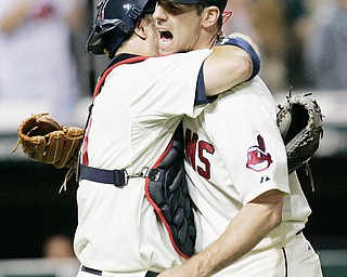 20-GAME WINNER: Indians catcher Kelly Shoppach, left, hugs pitcher Cliff Lee after a 5-0 shutout of the White Sox. Lee is the Tribe's first game winner in 34 seasons.
