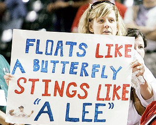 PROGRESSIVE SUPPORT: An Indians fan holds up a sign after her team defeated the White Sox on Monday at Progressive Field. Starter Cliff Lee tossed a five-hitter for the Tribe.