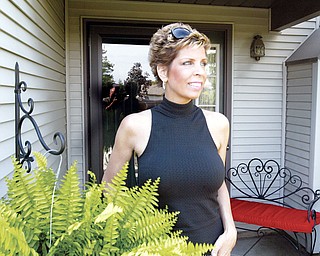 SURVIVOR: Lori Marsh of Canfield, who was diagnosed with Leukemia last July, is in remission and plans to return to work this week.
