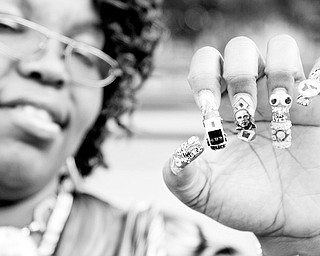 HANDY MESSAGE BOARD: Vernesser Barnes of Youngstown shows off her "Stop The Violence" fingernails, complete with a portrait of presidential candidate Barack Obama.