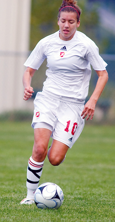 MOONEY LOSES: Mooney's Ashley Cuba carries the ball during Saturday's 8-1 loss to Walsh Jesuit in Struthers.