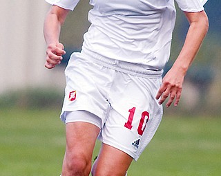 MOONEY LOSES: Mooney's Ashley Cuba carries the ball during Saturday's 8-1 loss to Walsh Jesuit in Struthers.
