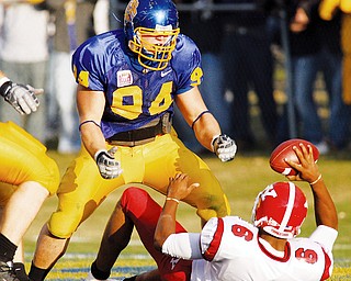 GROUNDED AGAIN: South Dakota State noce tackle Brian Fischer (94) celebrates his sack of Youngstown State quarterback Brandon Summers (6) for a safety in the second quarter of Saturday's game in Brooking's, S.D.
