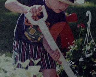 This is my grandson, Bryan, helping me plant flowers.
Judith Ferrett