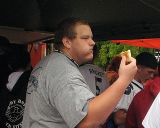 Tyler Bills eating a hot dog at the Blitz tailgate before the Fitch vs. McKinley game.