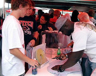 Pittsburgh Steelers' Nick Eason signing autographs at Blitz's tailgate party before the Austintown Fitch vs. Canton McKinley Game.