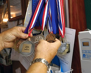 GREAT BREW: Richard Tomory has amassed an extensive collection of medals and awards for his home-brewed beer, mead and cider. The 1966 Campbell Memorial graduate, now 60, took up the hobby as a young man and was a charter member of the Great Northern home Brewers Club in Alaska, where he lived 31 years.