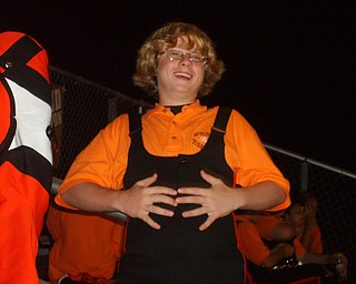Johnny Conder of The Springfield Local Marching Band looks happy as the band takes a break after performing at half time at the Lowellvile game.