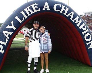 Official Jim DeNunzio and Cheerleader Cassandra Miller take a quick pic before game time!