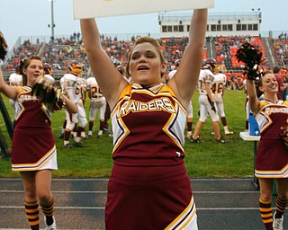 "South Range Senior Cheerleader Tizzy Baytos encourages the fans to yell GO!"