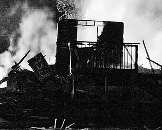The remains of a residence that caught fire after a house on the corner of Townsend and Washington Streets in Girard exploded Thursday, July 18, 2008. Daniel C. Britt.  