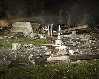 The remains of a house on the corner of Townsend and Washington Streets in Girard that exploded Thursday, July 18, 2008. Daniel C. Britt. 