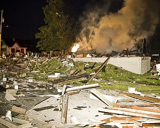 Debris from the explosion covered surrounding houses and lawns. Daniel C. Britt. 