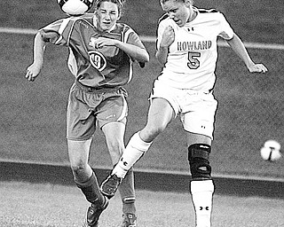 HOWLAND - POLAND - (5) Gina Albani of Howland and (19) Jeana Visingardi of Poland battle for the ball during their game Thursday night.
