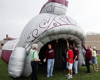 The Boardman High School Gridiron Club is seen with the large, inflatable tunnel the organization purchased for the team to emerge from during pregame entrances.