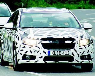Chevrolet unveiled its new Cruze to the press Wednesday, September 24, 2008 at the Paris Auto Show. 

Expected to get close to 40 miles-per-gallon, the Cruze will go on sale in Europe next March. Production for U.S. sales will begin in 2010. 
