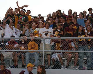 "South Range students cheer on the Raider football team Friday night."