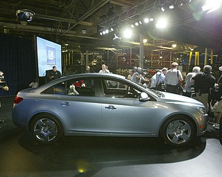 Chevrolet unveiled its new Cruze to the press Wednesday, September 24, 2008 at the Paris Auto Show. 

Expected to get close to 40 miles-per-gallon, the Cruze will go on sale in Europe next March. Production for U.S. sales will begin in 2010. 
