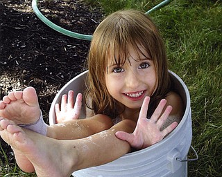 This is 5-year-old Riley Sweder's idea of "helping" her father, Mike, wash his car. The Sweder family is from Struthers.