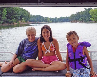 Rochelle Bees, left, and cousins Brooke and Anthony Vitullo take a boat ride on Lake Berlin. Parents: Roxane Bees and Tony and Sherry Vitullo, all of Youngstown.