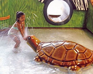 Lindsay Zublena, 5, of Canfield, plays at the Kalahari Waterpark. She went with her parents, Rick and Karen, and her brother, Robby, 9.