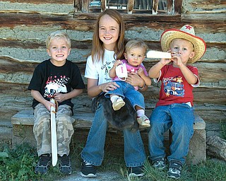 Here is a shot from our vacation to Fort Bridger, Wyoming. Pictured from
left to right are Nicholas LaPlante, Venice Sheehan (Wood's Landing, WY)
Hannah LaPlante, and Alex LaPlante (the LaPlante kids are from Poland, OH.
Venice is their cousin who traveled from Woods Landing, WY).