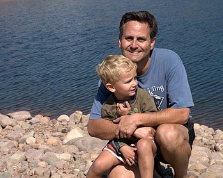 From our vacation to the mountains of southwestern Wyoming.
On the rocky shores of Meeks Cabin Dam reservoir with
Tokewanna Peak (which is in northern UT) in thAlex
and Hannah LaPlante (taken by father John) and John and Alex LaPlante (this
photo was taken by 6-yr-old Nicholas LaPlante). All are from Poland, OH.
Laurie LaPlante