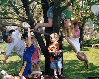 Matt, Allie and Kristen Kubina hang out with Danny, Evan and Maggie Beistel in Grandma Linda Masi's back yard in Youngstown.