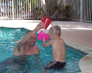 Ryan Matey with Uncle JT Joyner (from Kent, Ohio) having a water fight in the pool on vacation in Key Largo, Fla. Sent by Kelly Matey, New Springfield