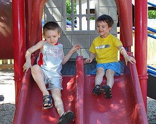 Brothers, Aidan (5) and Liam (3) Murphy, sons of Kevin and Theresa Murphy of Bezetta Township, have a fun day at Boardman Park. They had spent the day with Mrs. Miller, teacher at Ursuline High School, reading at the library as part of the summer reading program and having some fun on the slide!