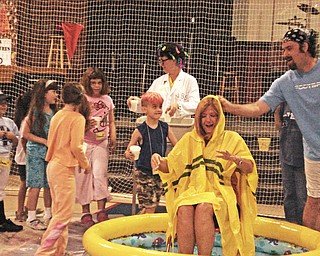 I spent a week of this summer teaching Vacation Bible School for second graders at Highway Tabernacle church on Kirk & Raccoon Rd. . On the last day of VBS, the kids took part in "sliming" me as part of their reward for having made the highest donation. As the kids gleefully poured the cold, green, sticky slime on me, it didn't help that the youth Pastor Lou Scalzo sneeked in and took the hood of my cape off. I was soaked! But the kids enjoyed it so it was worth it.
Marianne B Lordi
Youngstown, OH