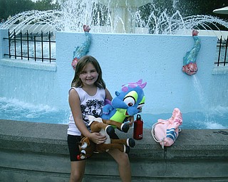 This is my daughter Kylie Thomas on her 7th birthday. She wanted to go to Pittsburgh for her birthday. This is her at the fountain at Kennywood Park with the stuffed animals she won herself.
Shannon Thomas
Poland, OH 44514