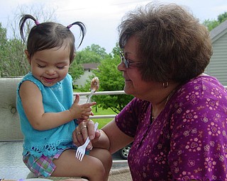 Adriana Trafficante of Boardman enjoying a summer day with Grandma 'Beeps'
Ezzo of Youngstown. Ofcourse treats were involved! Picture taken by John
Trafficante of Boardman.
