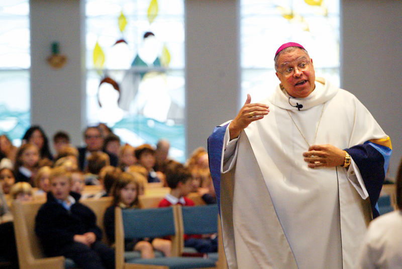 Bishop George Murry delivers a Homily during a mass at Holy Family in Poland Wednesday.