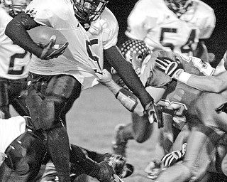 Fitzgerald Toussaint of Liberty tries to break free of Lakeview's Ethan Methany.