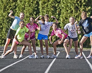 Canfield Cardinals Cross-Country Girls: L-R, Jillian Smith, 16, Elizabeth Wilkens, 16, Katie Tiberio, 15, Nicole Tiberio, 15, Shannon Reed, 18, and Cathyrn Zetts, 15, and Marla Marucci, 15, all of Canfield. Daniel C. Britt.