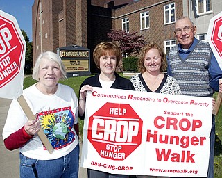 TAKING STEPS TO WALK: Promoting the annual CROP Walk that'll take place Sunday are, from left, Shirley Megown, president of Church of Women United, which supports the event; the Rev. Joyce Lawson, CROP Walk coordinator; Monica Spelich, walk treasurer; and Jack Ritter, president of the Mahoning Valley Association of Churches, walk sponsor.