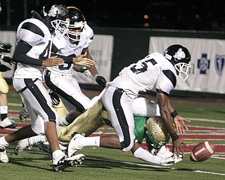 Buchtel Griffin Kash King (5) is forced into his own end zone in order to stop Ursuline Fighting Irish Wade Daniels (24) from scoring a touchdown.