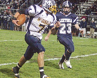 LEETONIA - MCDONALD - (23) Seth McNally of Leetonia tries to track down (7) Mike Thomas after a big gain during their game Friday night at Leetonia.